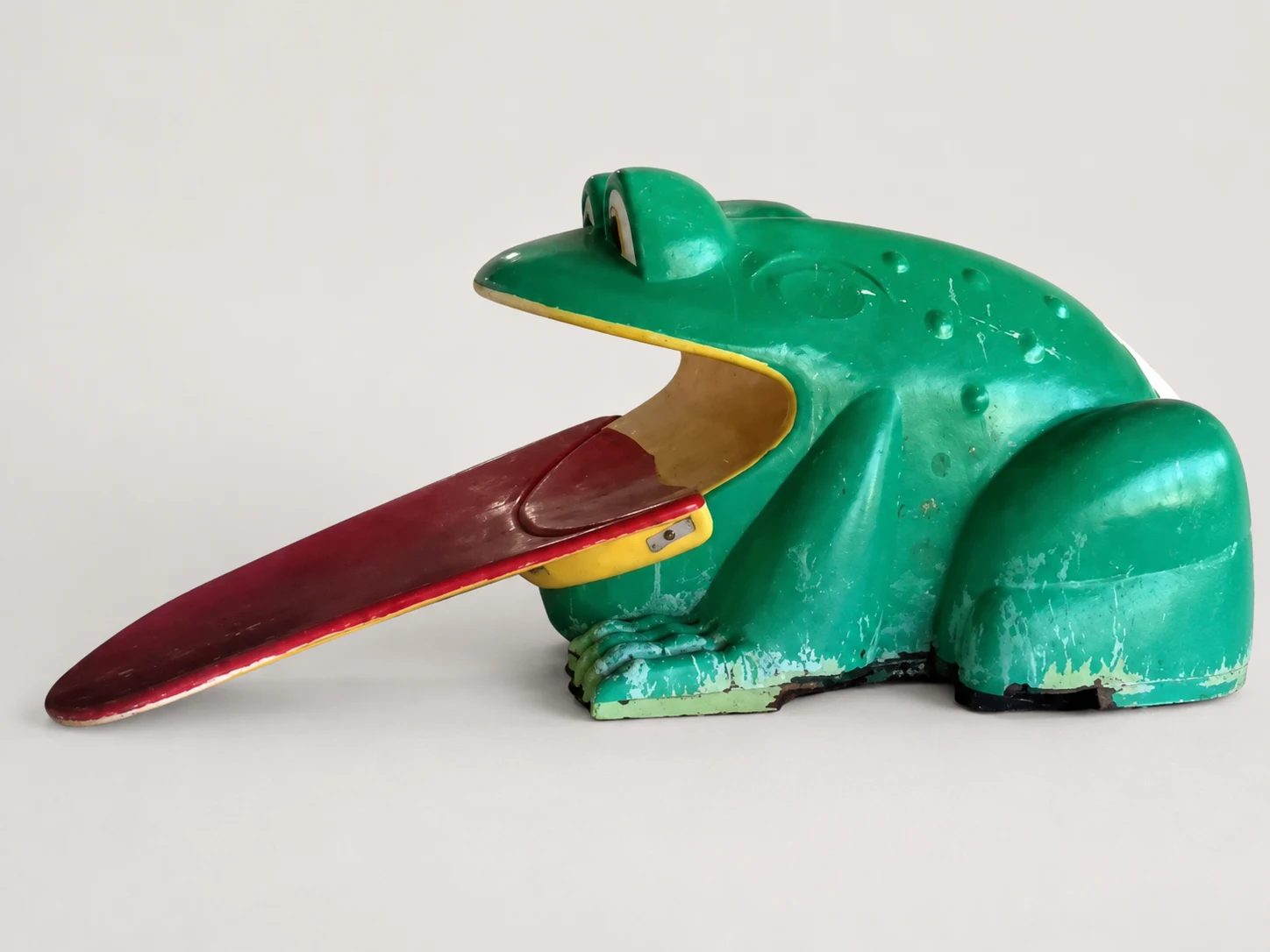 Frog slide before refurbishment with visible fading, coating wear, and surface deterioration